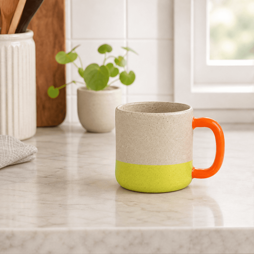 The same handmade ceramic mug styled on a bright kitchen counter