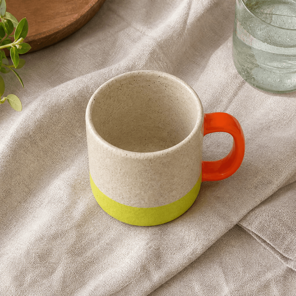 The same handmade ceramic mug styled on textured linen in natural light